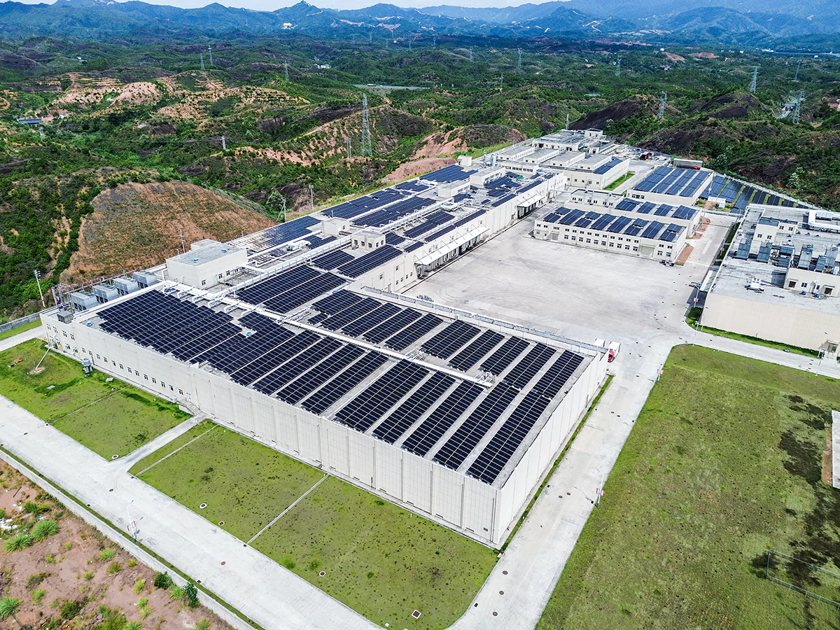 Industrial battery storage installation with technicians